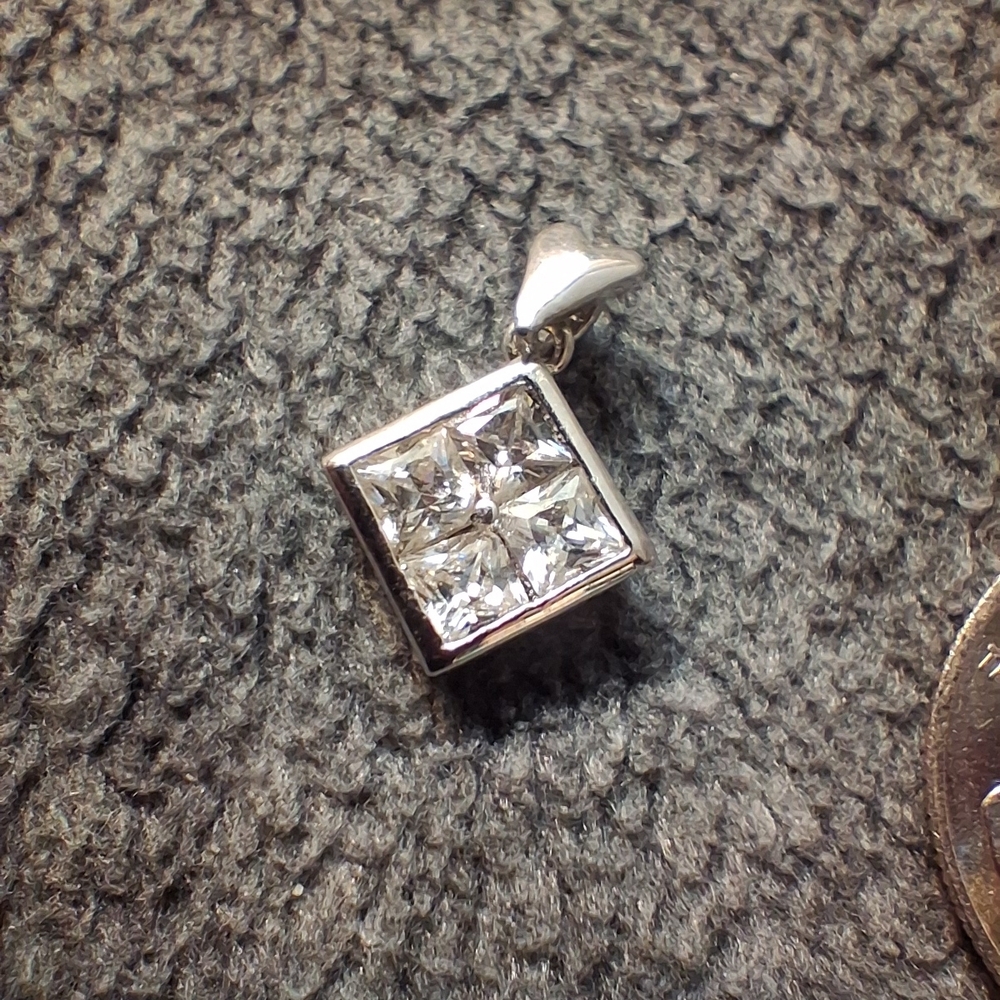 Elegant Silver Pendant with Clear Stones